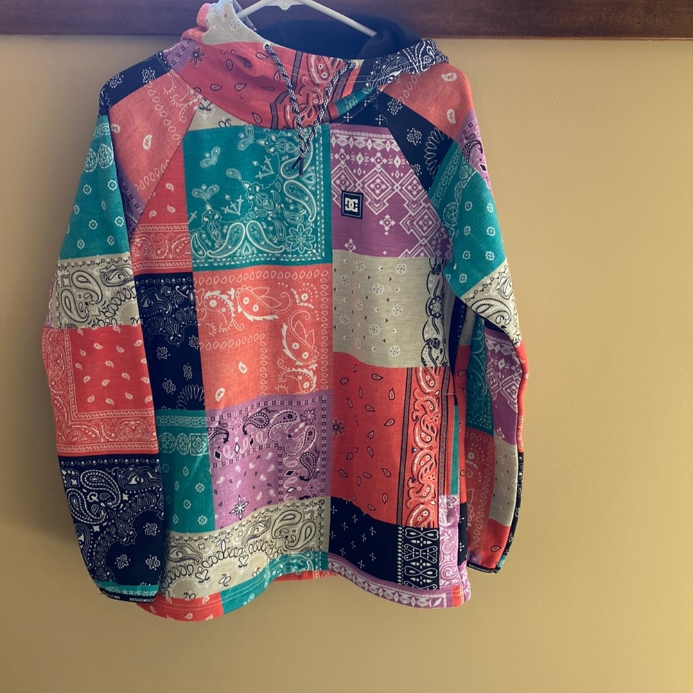 Women’s DC hoodie. Multi colored bandanna pattern. Size medium.